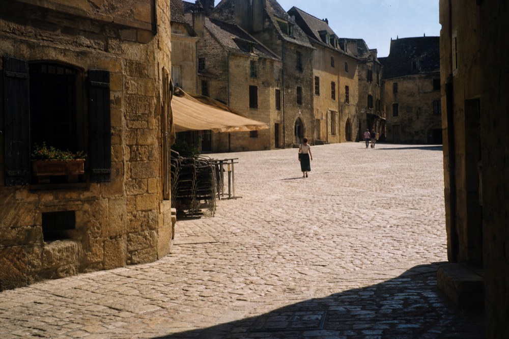 Main square of Saint-Emilion village with medieval stone buildings, no text, no logos, no people.